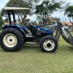 Trator New Holland TL75E 4x4 Ano 2005 com conjunto de concha Almeida